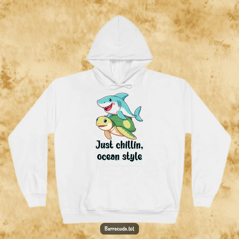 Funny Barracuda hoodie illustrating a cheerful barracuda enjoying a ride on a friendly sea turtle, a humorous and cozy ocean-themed garment.