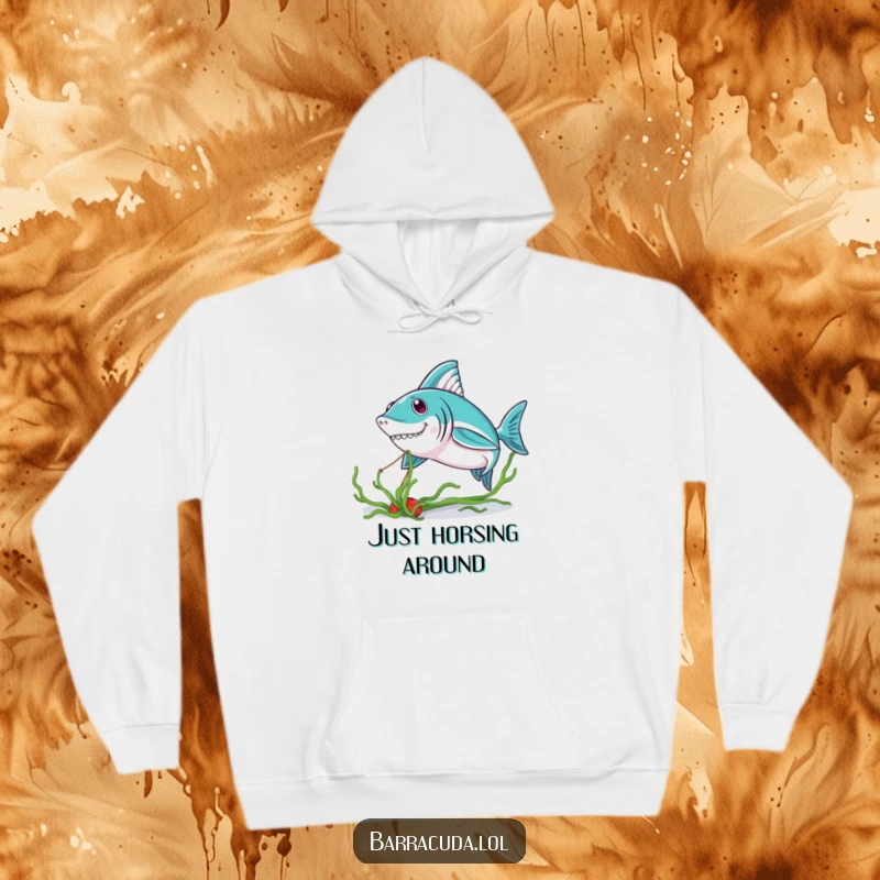 Funny Kawaii Barracuda Hoodie: a cute barracuda playfully pulling on a piece of seaweed, offering warmth and smiles.