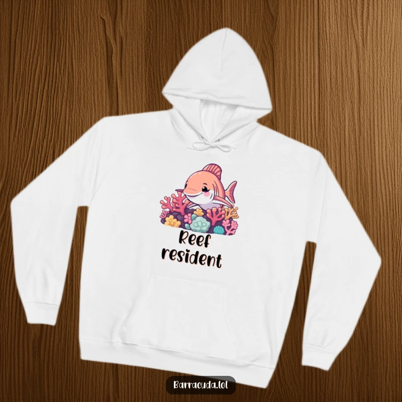 Funny barracuda hoodie, a playful barracuda winks from behind a detailed coral reef, offering warmth and humor for the wearer.