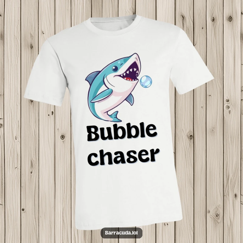 Funny barracuda t-shirt showing a fish playfully chasing a tiny, sparkling bubble, representing joy and innocent pursuit.