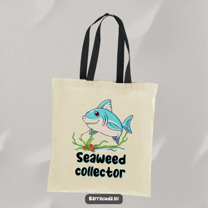 Funny Kawaii Barracuda Tote Bag: a cute barracuda playfully tugging on seaweed, showcasing style and ocean humor.